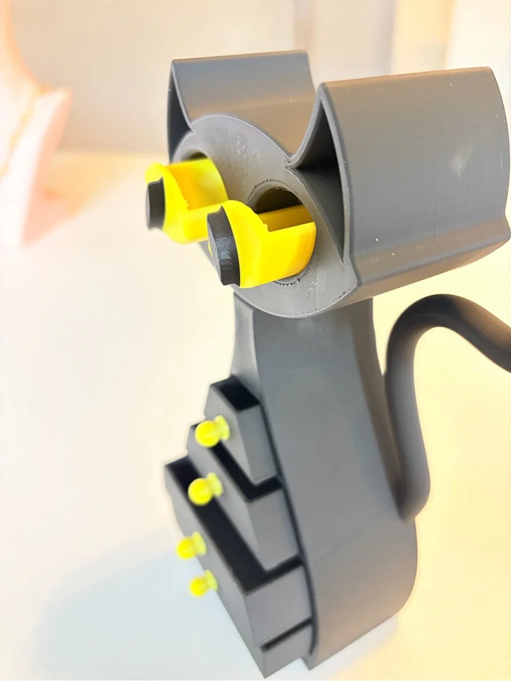 3D Printed Black & Yellow Cat Jewelry Organizer.